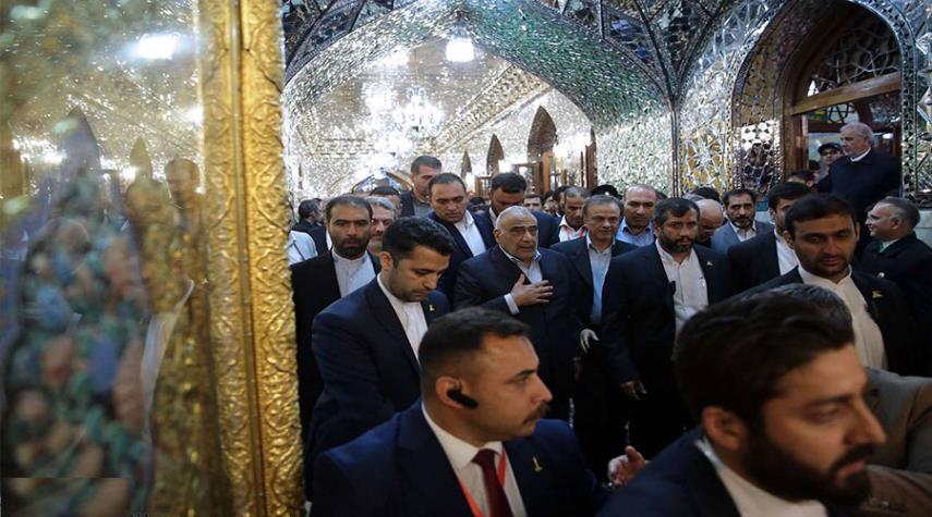 رئيس الوزراء العراقي يزور مرقد الامام الرضا (ع) في مشهد + صور